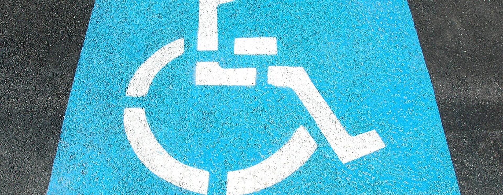 logo blanc sur fond bleu du handicap